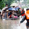 Floods, typhoon kill dozens in China