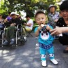 China eases one-child policy and ends labor camp system