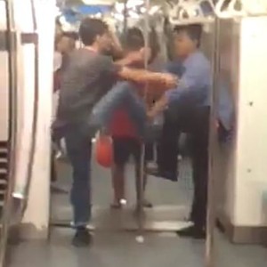 2 men arrested in video fighting on Singapore MRT train